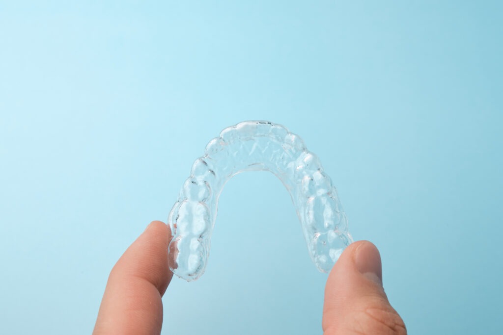 Clear Essix retainer for orthodontic retention at Texas Family Orthodontics in San Antonio.